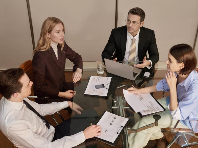 Plaud Note Pro on a conference table during a team meeting